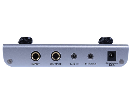 Audio interface with input, output, aux in, and phone connectors on a white background - back view