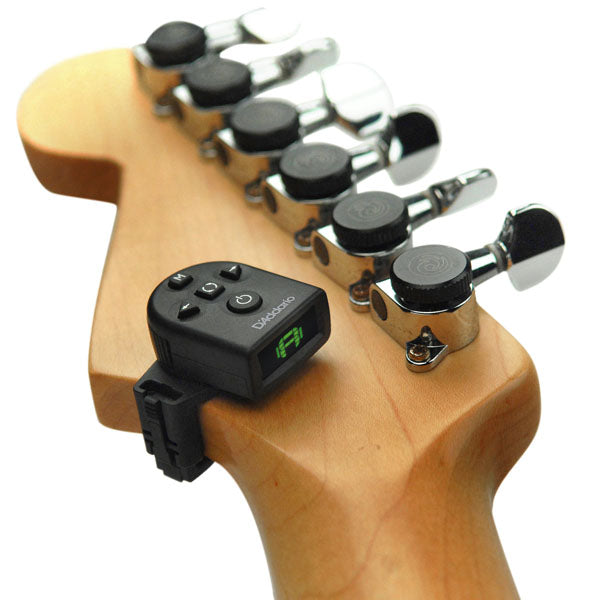Guitar headstock with a Tuner on a white background