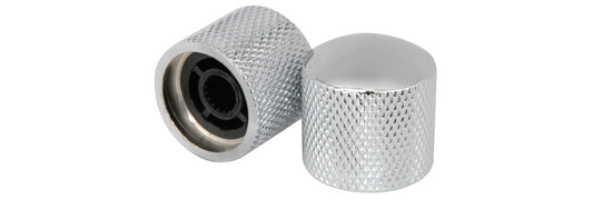 Two metallic knobs with textured surfaces on a white background