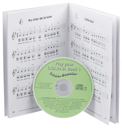 Ocarina instruction book with music notes and a CD inside
