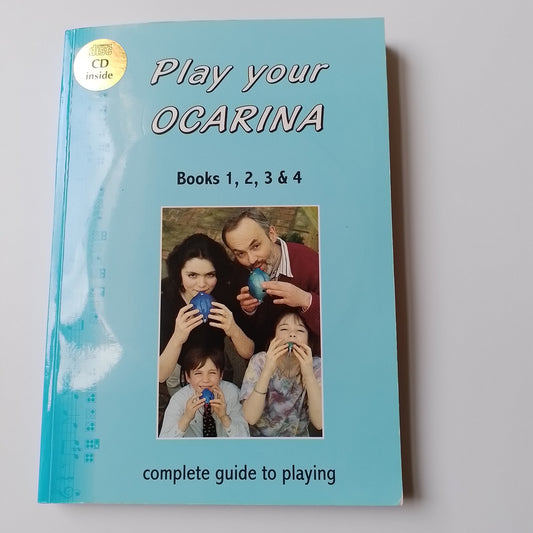 A book titled 'Play your OCARINA' for Books 1, 2, 3 & 4, featuring a light blue cover with a photo of a family playing with blue ocarina. A gold 'INCLUDES CD' sticker is visible in the top-left corner.