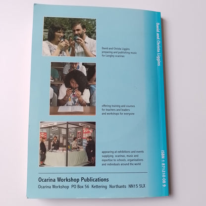 A book back cover 'Ocarina Workshop Publications' by David and Christa Liggins, shown flat against a plain white background. The cover is light blue with three small inset photographs and text describing workshop activities and resources.