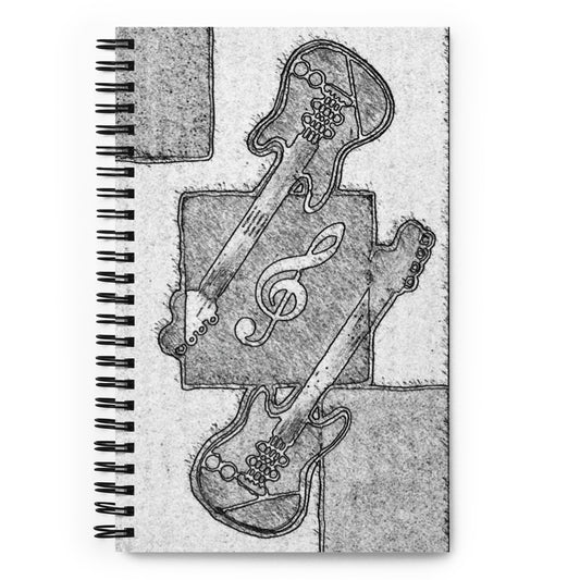 Notebook with black and white guitar and music note design on a textured background