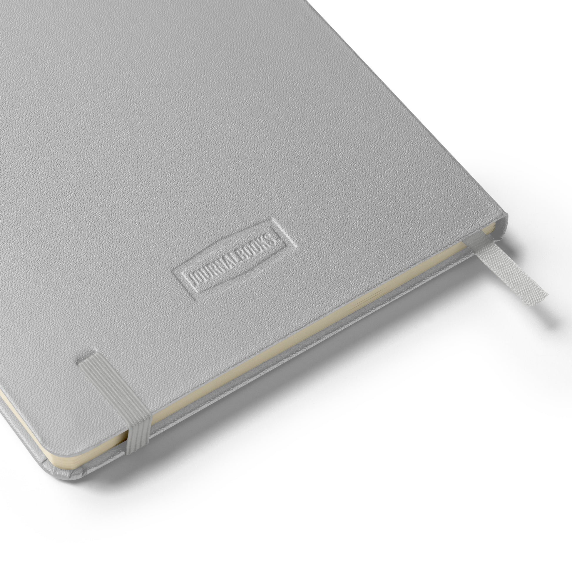 Silver notebook with a brand logo on a white background