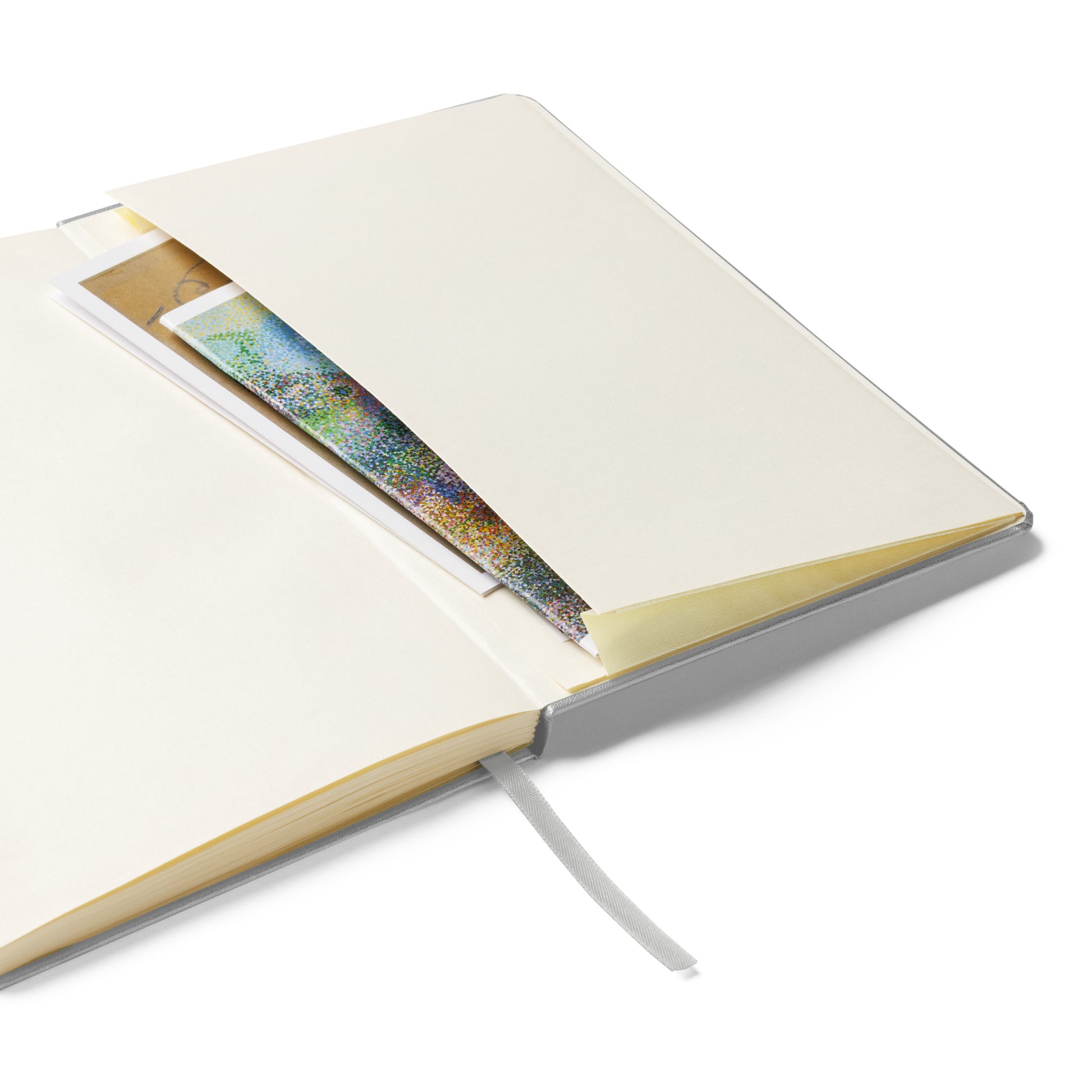 Open notebook with a pocket on the back cover to place notes in - on a white background