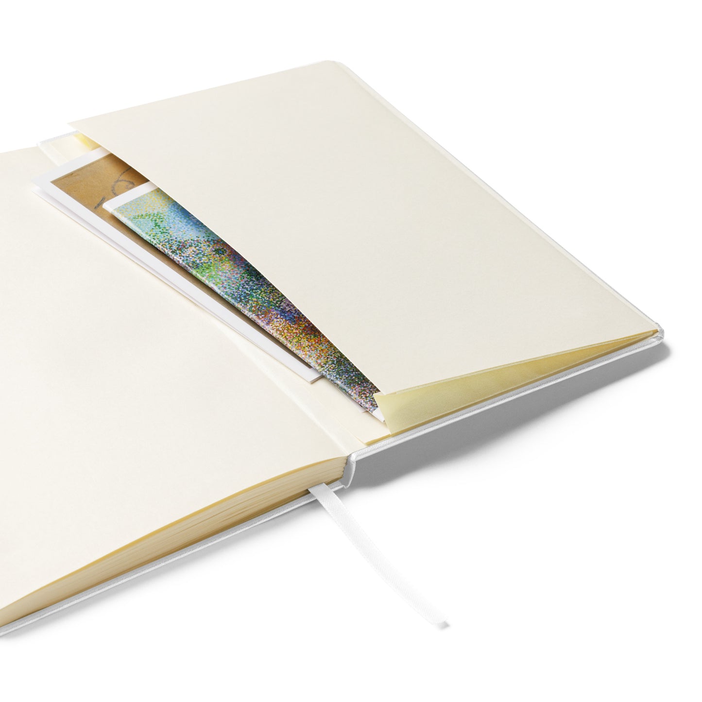 Open notebook with a pocket on the back cover to place notes in - on a white background