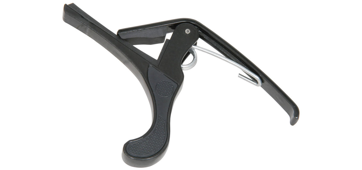 Black guitar capo on a white background