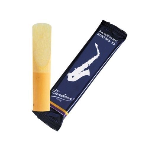 Saxophone mouthpiece with Vandoren packaging on a white background