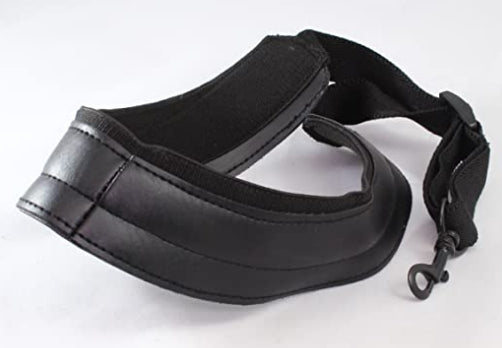 Black sax strap with padding and black clip on a white background