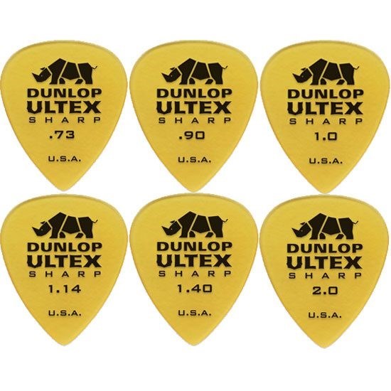 Dunlop Ultex guitar picks with varying thicknesses on a white background