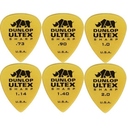 Dunlop Ultex guitar picks with varying thicknesses on a white background