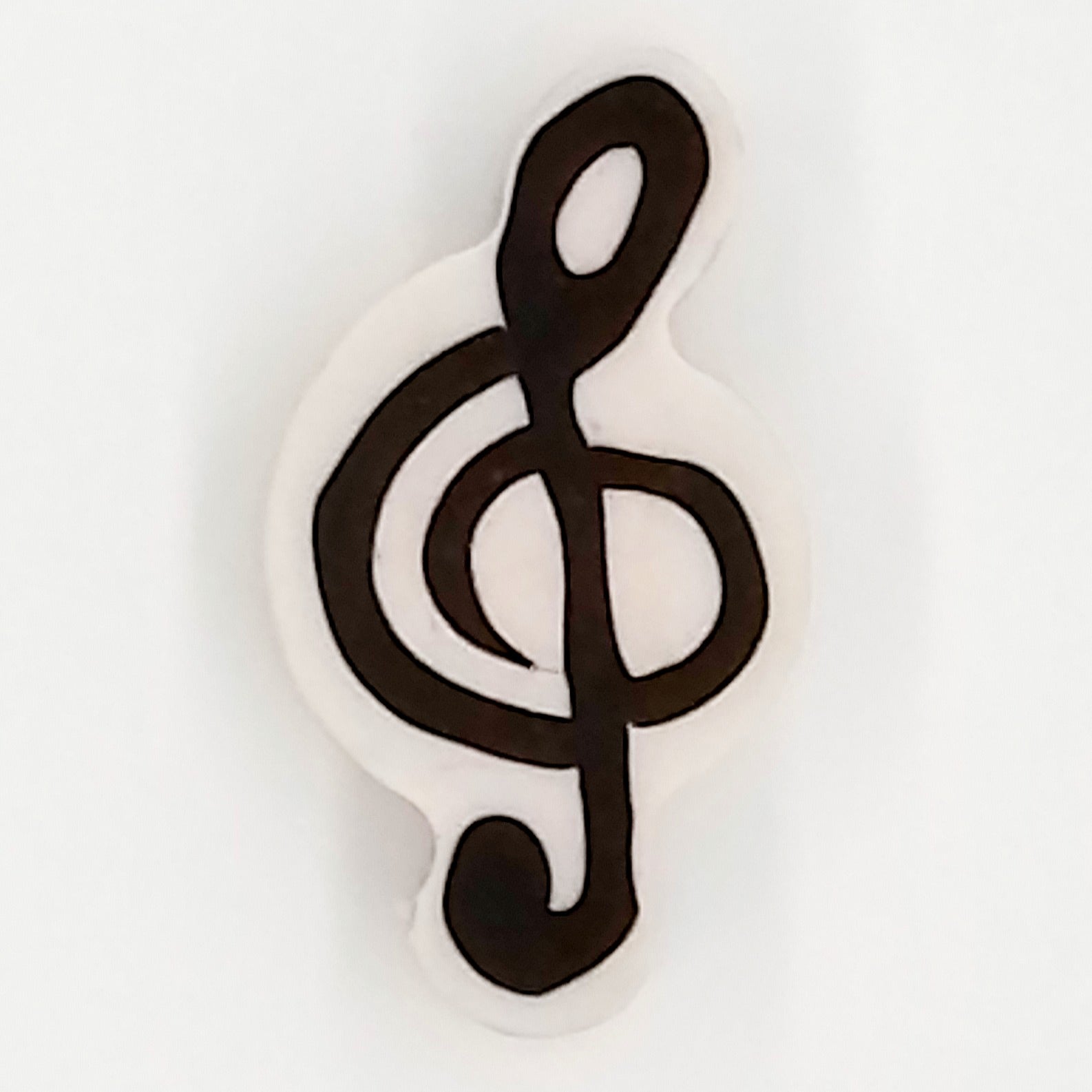 Black and white treble clef eraser l on a white background