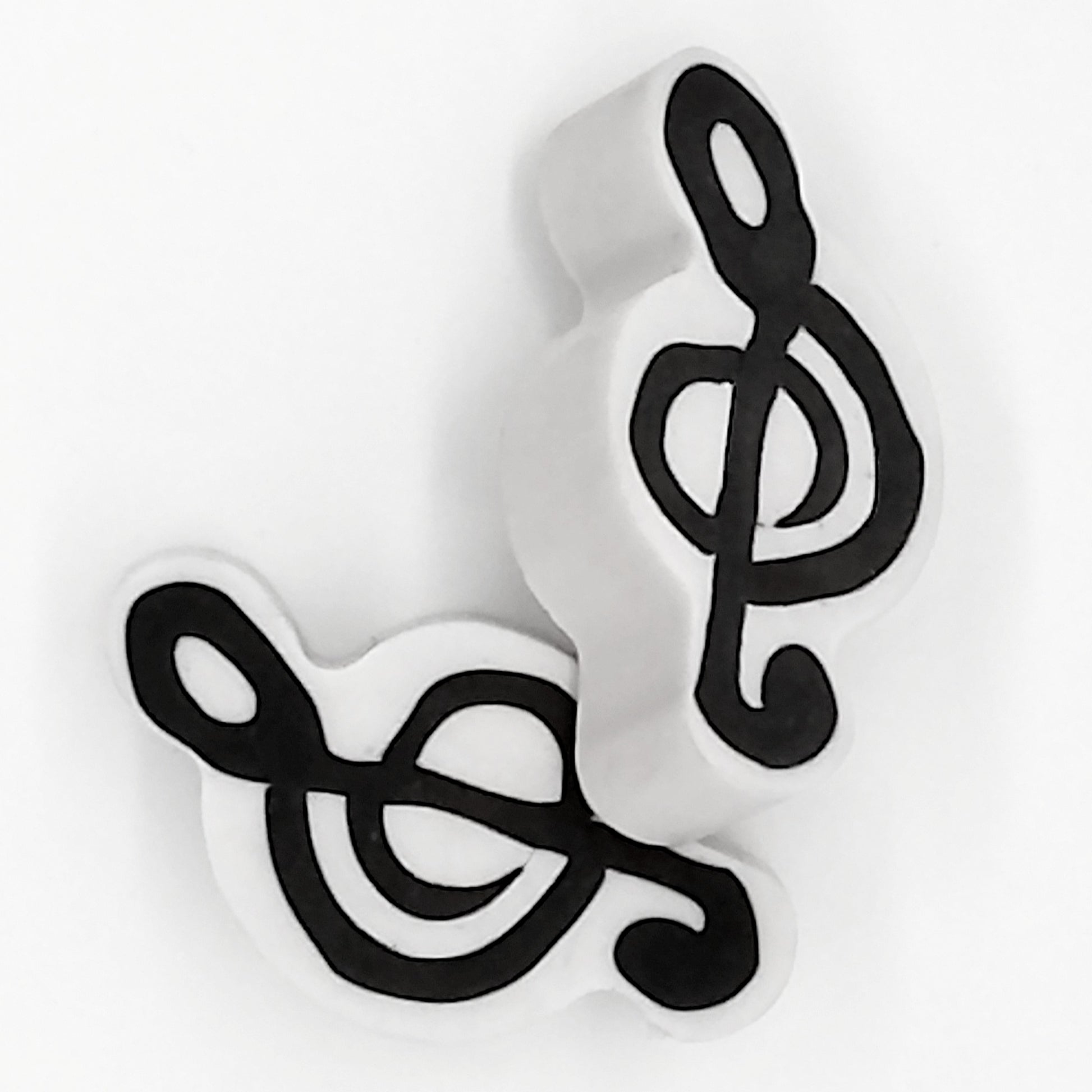 two black and white erasers showing both front and back view