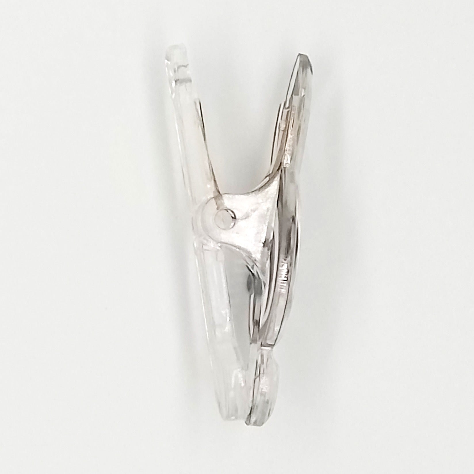 Clear plastic clip on a white background