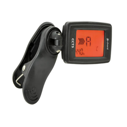 Black clip-on guitar tuner with digital display on a white background