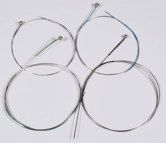 Set of four circular metal components with wires on a light gray background