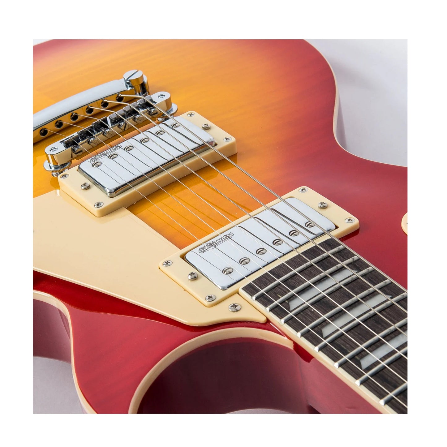 Close-up of a red electric guitar with a white pickguard on a white background