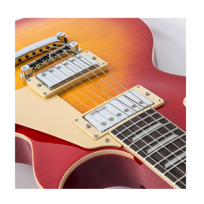 Close-up of a red electric guitar with a white pickguard on a white background