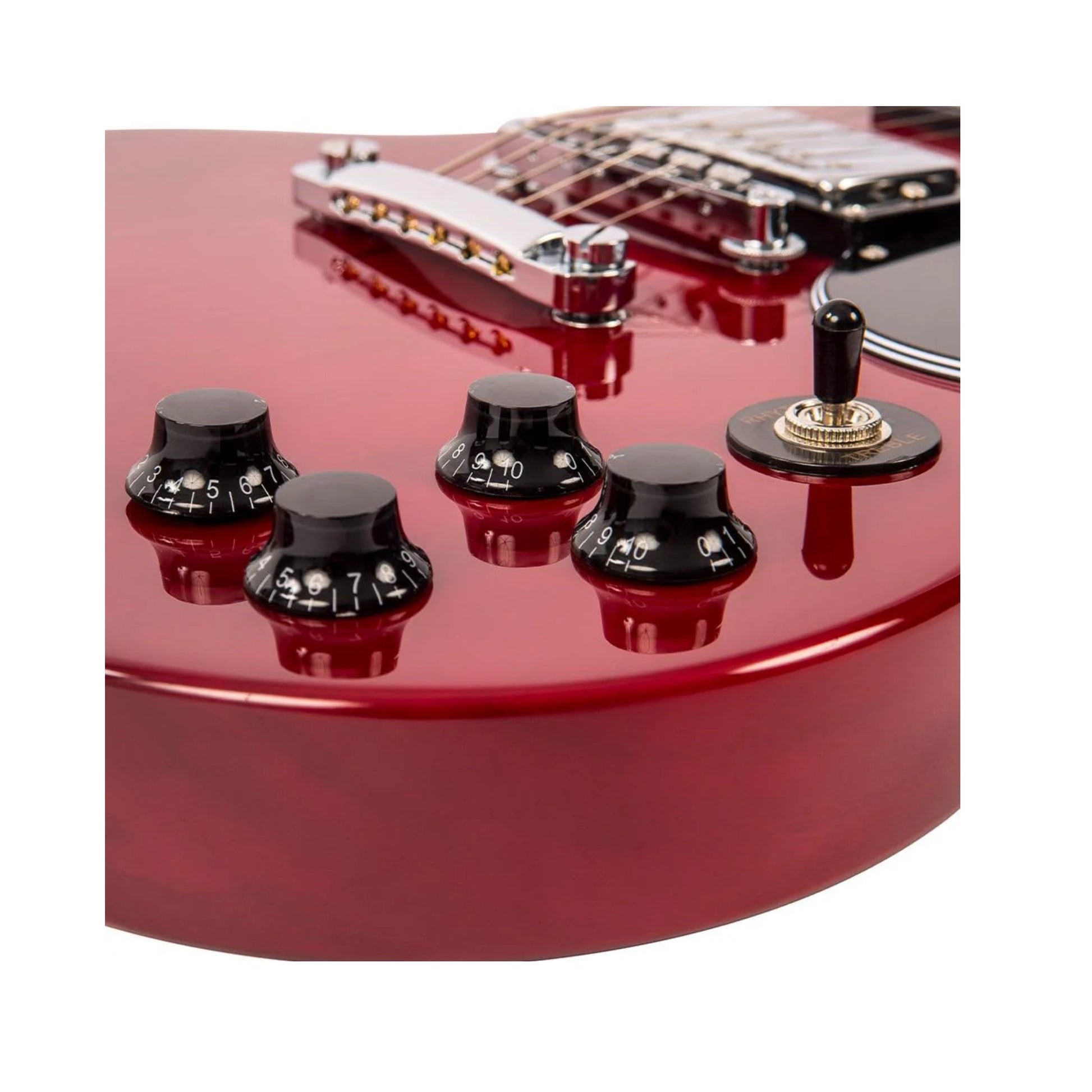 Close-up of a red electric guitar with focus on  control knobs and a 3-way switch.