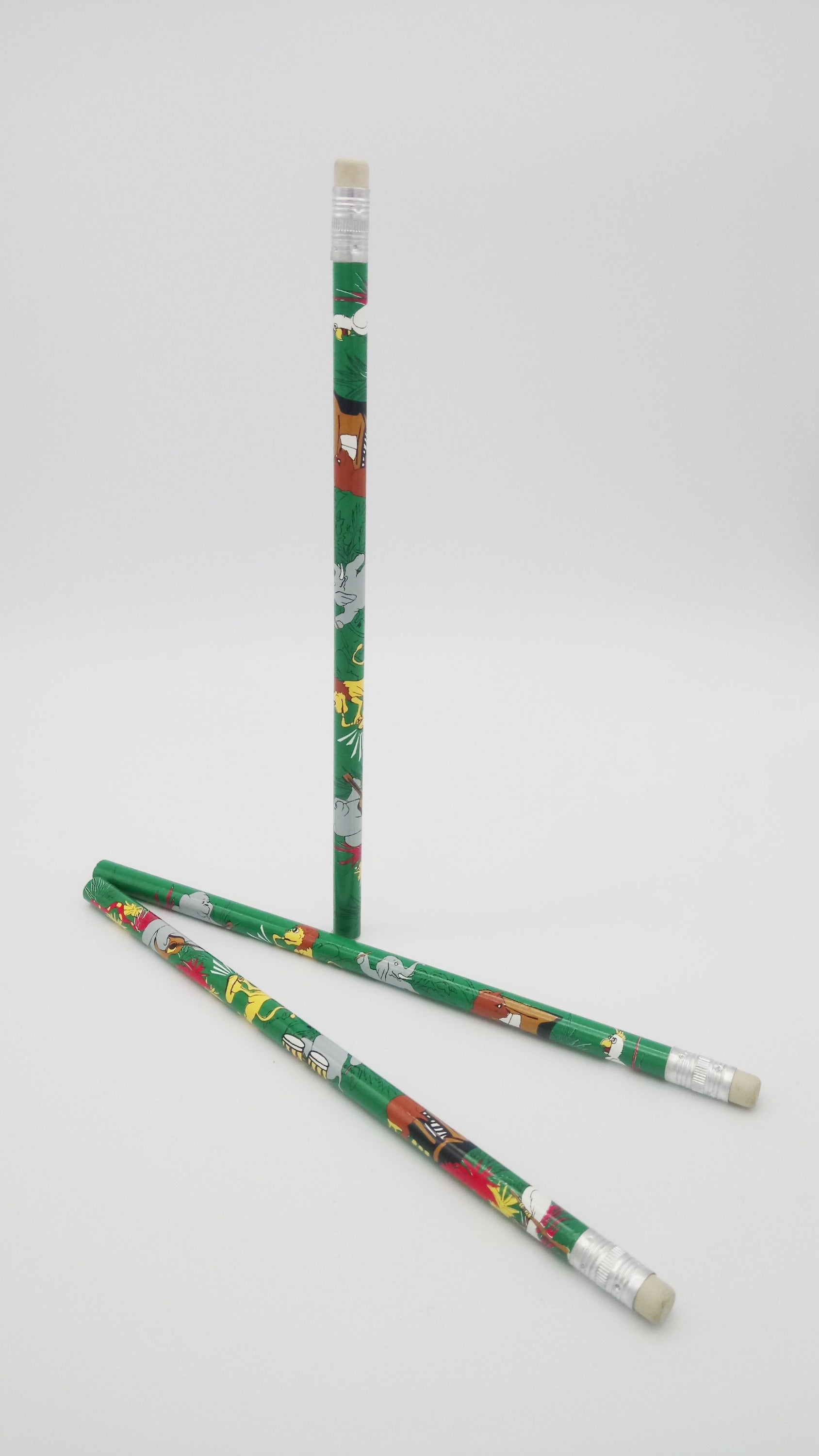 Two green pencils with colourful animals playing musical instruments designs on a white background