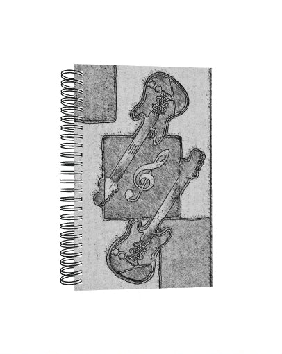 short video. Notebook with black and white guitar and music note design on a textured background