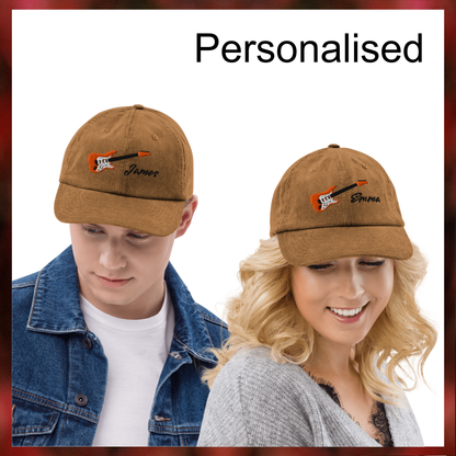 Two brown baseball caps with guitar designs worn by a man and a woman on a white background.