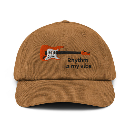 Brown cap with guitar graphic and 'Rhythm is my vibe' text on a white background