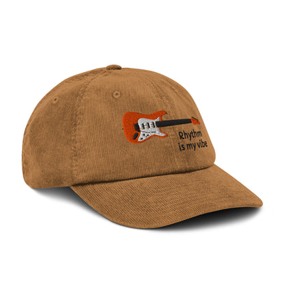 Brown cap with a colorful fish embroidery on a white background