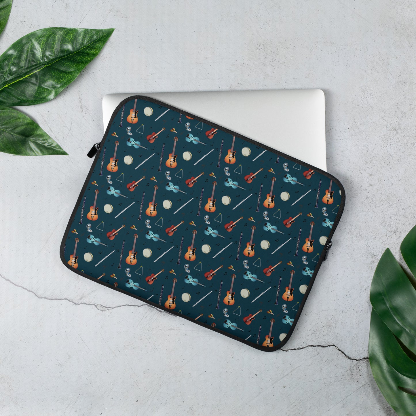 Laptop sleeve with musical notes, guitar, bass guitar, flute, tambourine, triangle and clarinet  pattern on a blue/green background