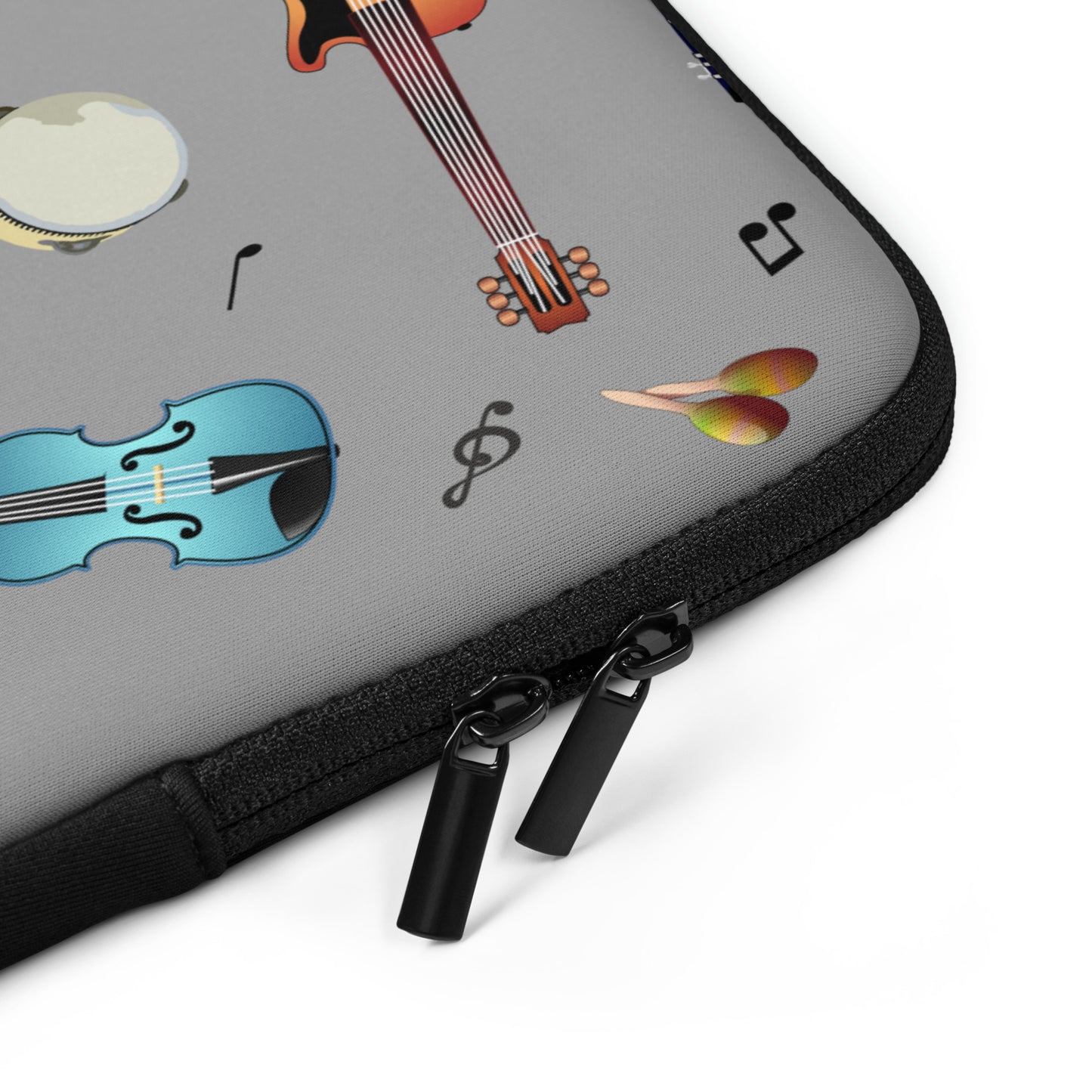 Gray laptop case with musical instrument design on a white background