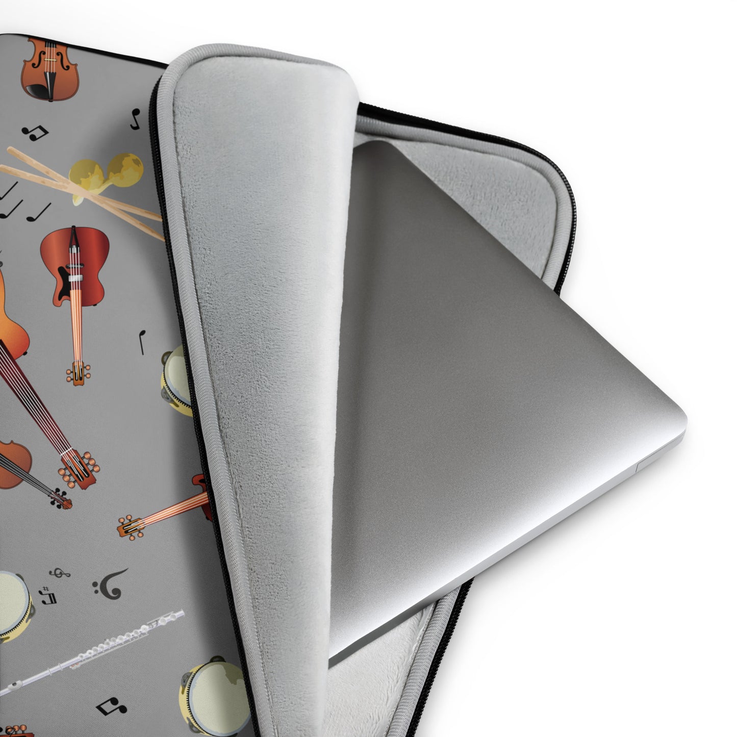 Gray laptop case with musical instrument design on a white background
