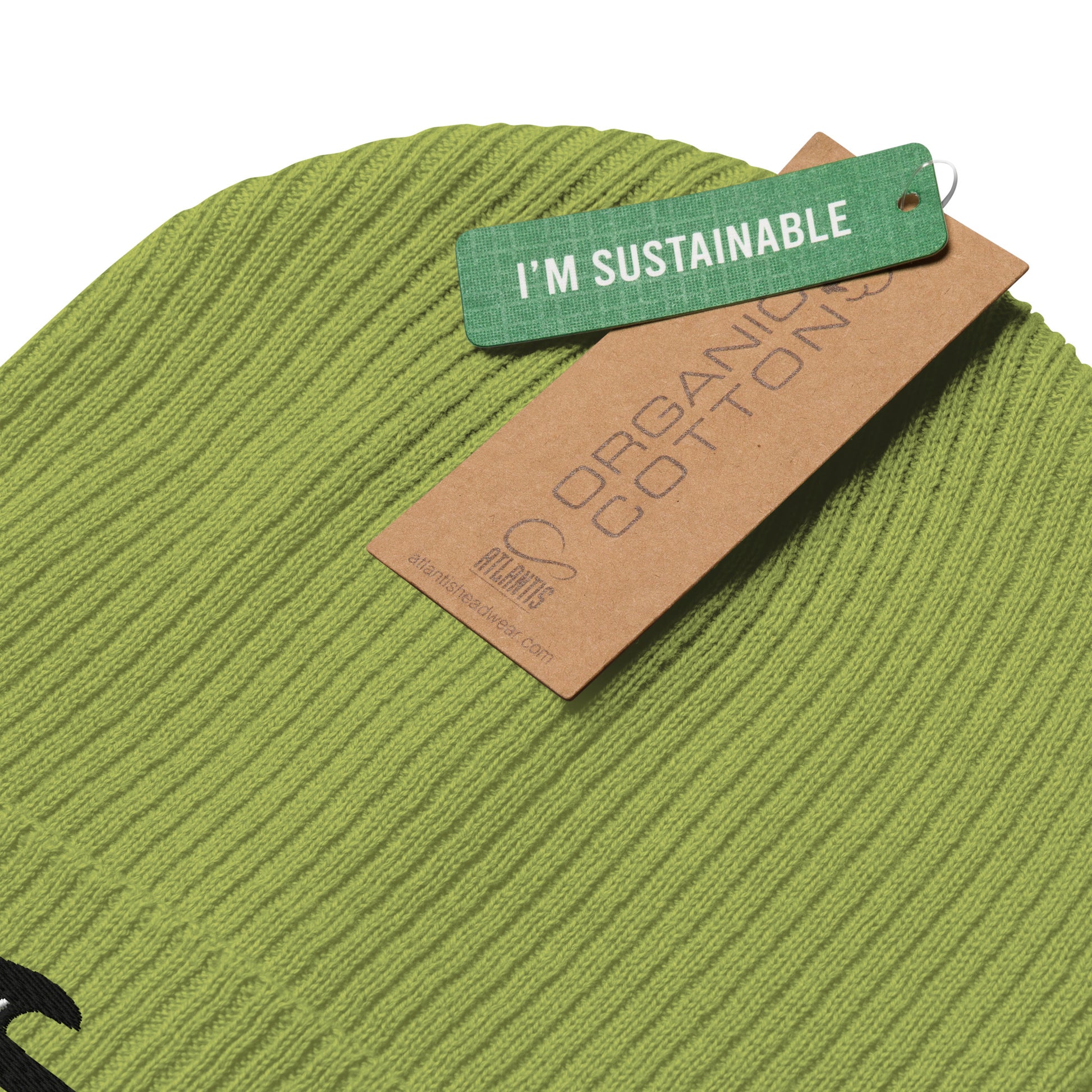 Green fabric with a 'I'm Sustainable' tag on a white background