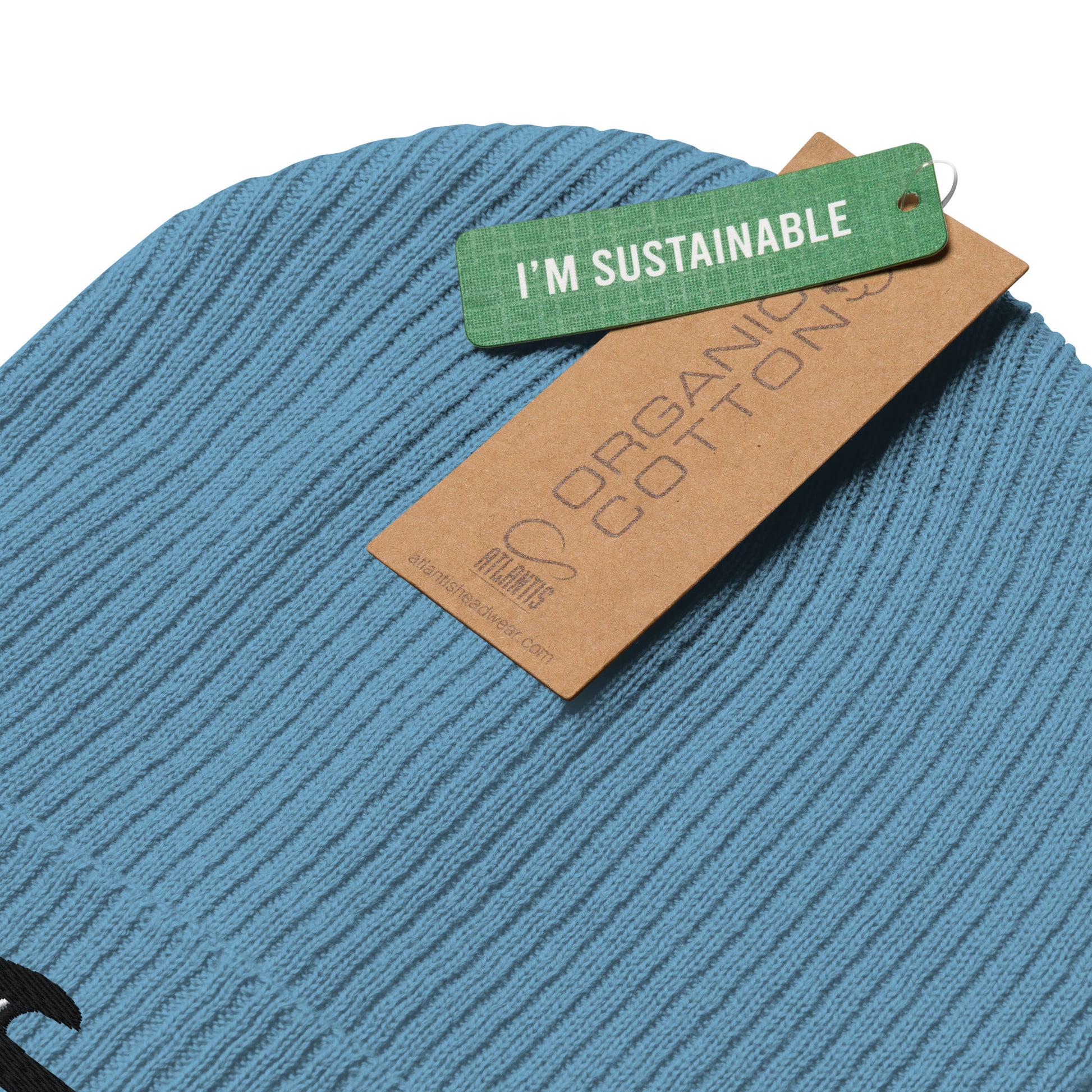 Blue fabric with a 'I'm Sustainable' tag on a white background