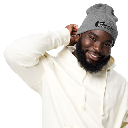 Man wearing a white hoodie and gray beanie with a logo on a white background